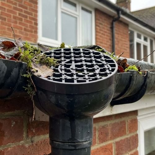 Aquaflow 160mm Round Drain Cover Grid fitted onto gutter - installed